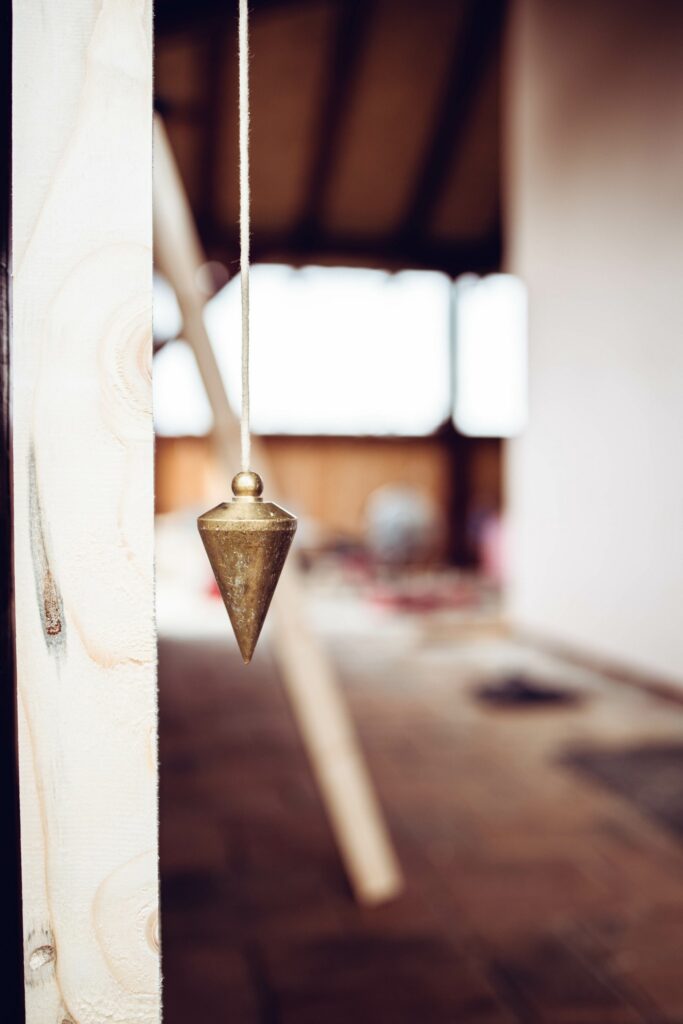 Close-up of a pendulum, construction tool, hanging